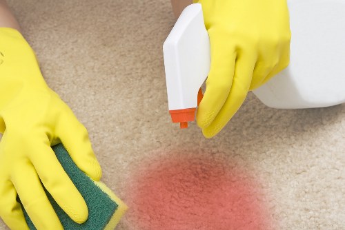 Cleaning team removing post-renovation dust in an N1 property